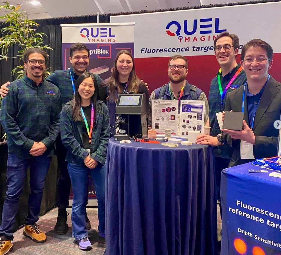 Quel team tabling at a conference with product demos.